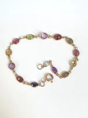 Vintage, 9ct Gold, Multi Gem Bracelet featuring, Peridot, Garnet, Amethyst, and Topaz