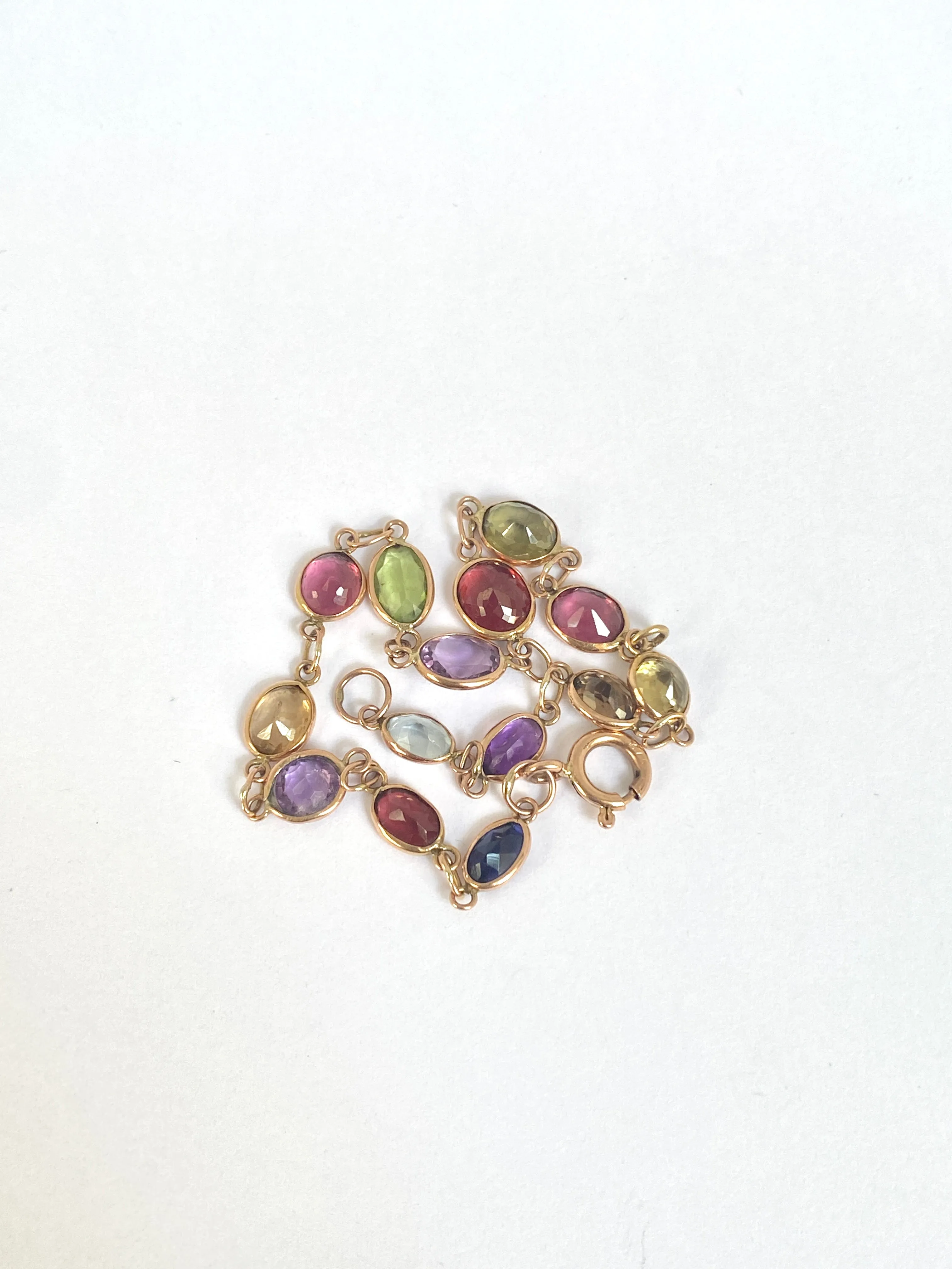 Vintage, 9ct Gold, Multi Gem Bracelet featuring, Peridot, Garnet, Amethyst, and Topaz