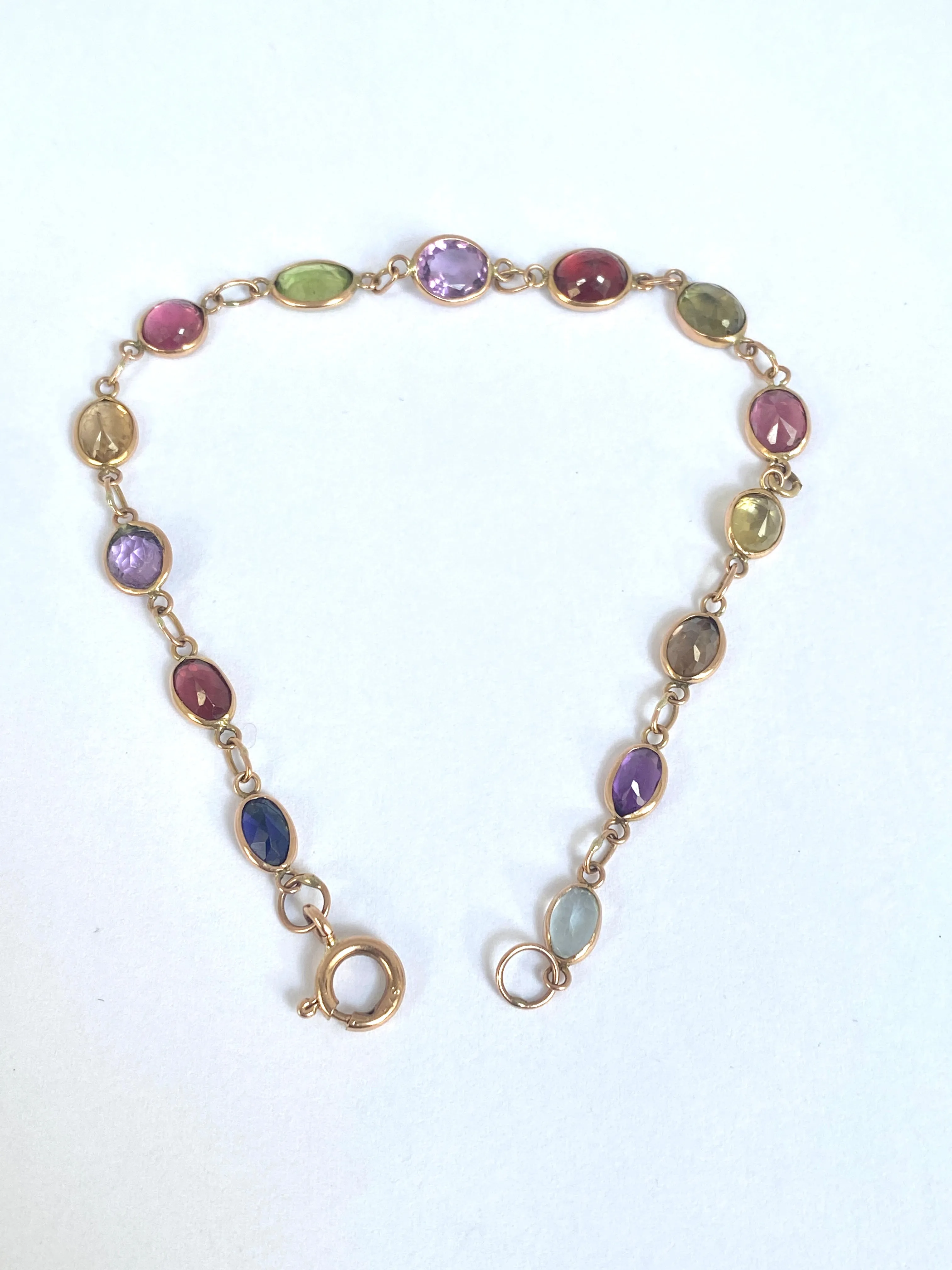 Vintage, 9ct Gold, Multi Gem Bracelet featuring, Peridot, Garnet, Amethyst, and Topaz