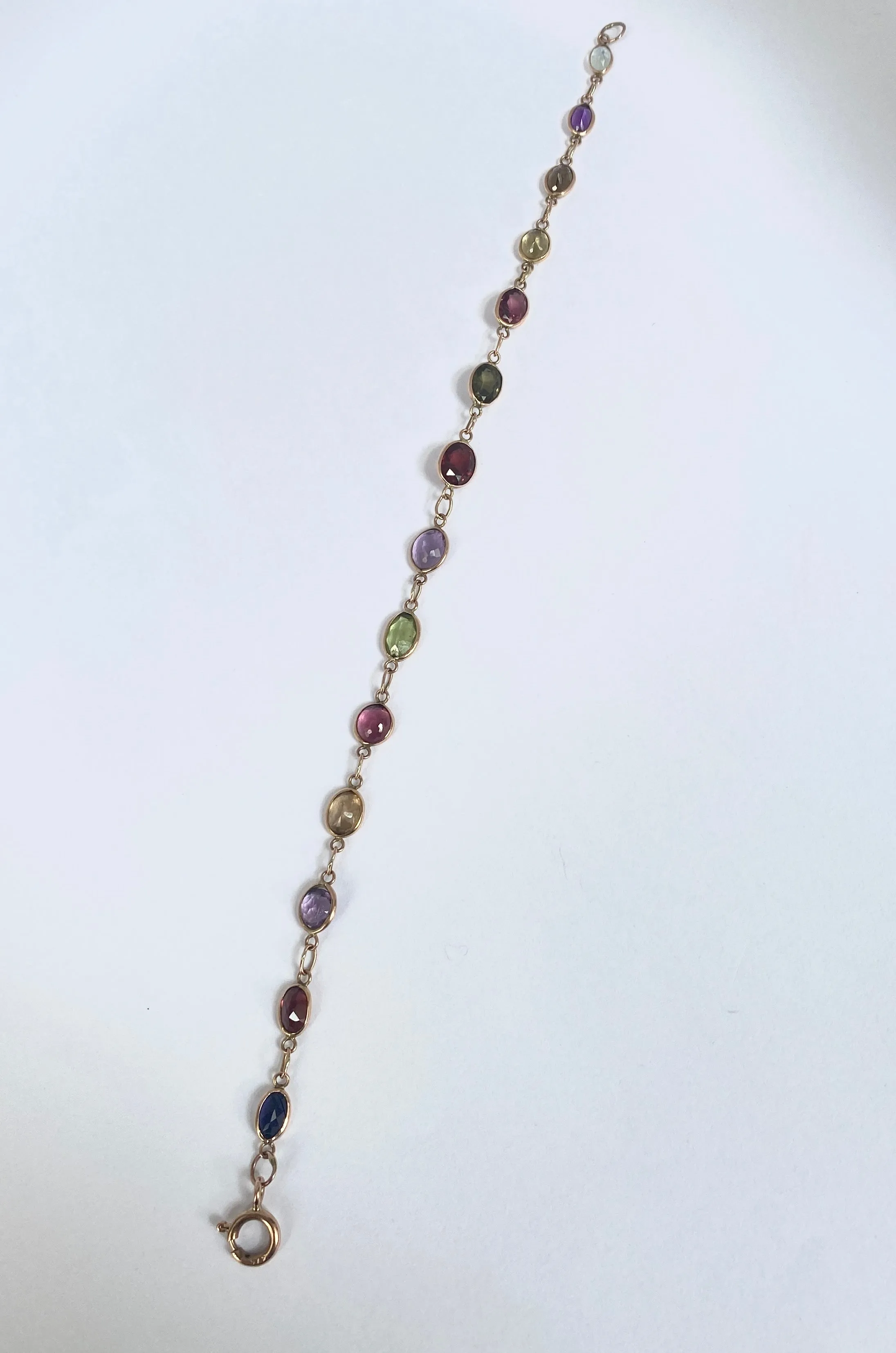 Vintage, 9ct Gold, Multi Gem Bracelet featuring, Peridot, Garnet, Amethyst, and Topaz